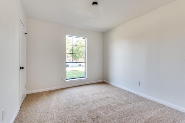 unfurnished room featuring carpet