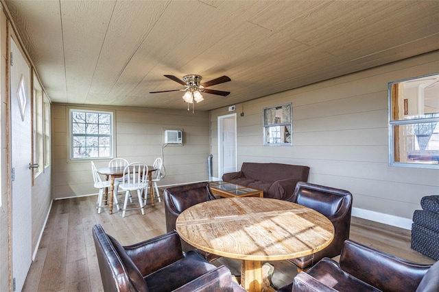 interior space with hardwood / wood-style floors, wooden ceiling, baseboards, and a ceiling fan