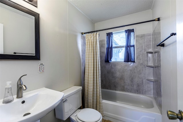 full bathroom with shower / bath combo, sink, a textured ceiling, and toilet