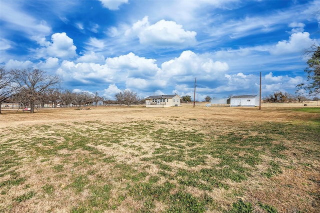 view of yard with a rural view