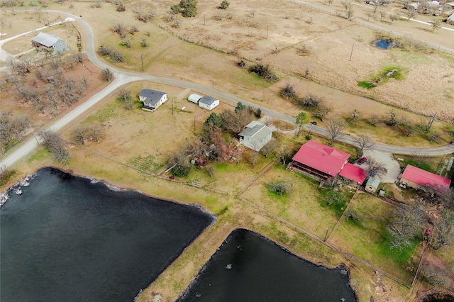 bird's eye view with a water view and a rural view