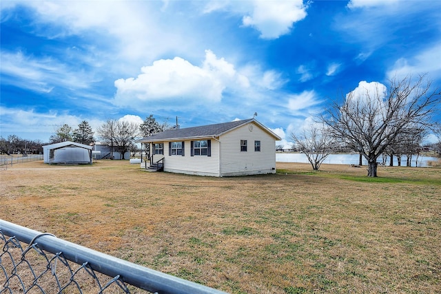 exterior space with a front yard, entry steps, fence, and crawl space