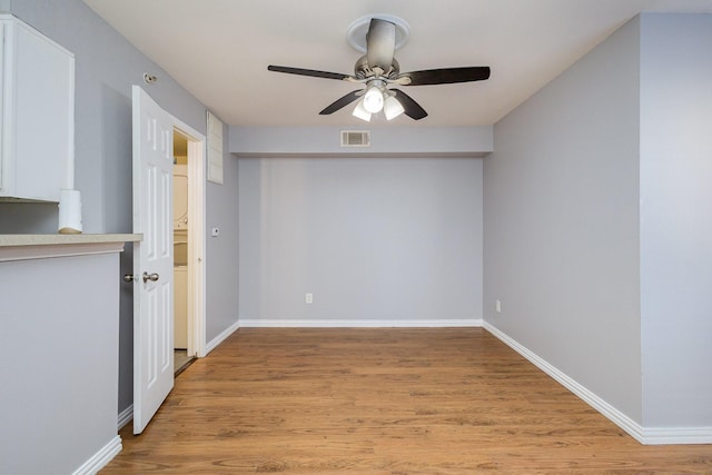 unfurnished room featuring ceiling fan and light hardwood / wood-style floors