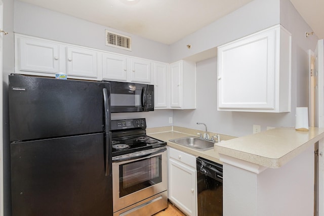 kitchen featuring black appliances, white cabinets, kitchen peninsula, and sink