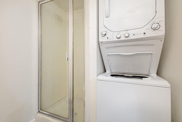 laundry room with stacked washer and dryer