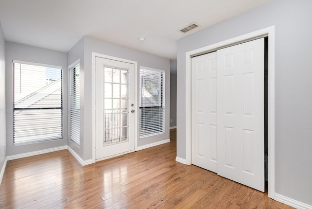 doorway to outside featuring light wood-type flooring