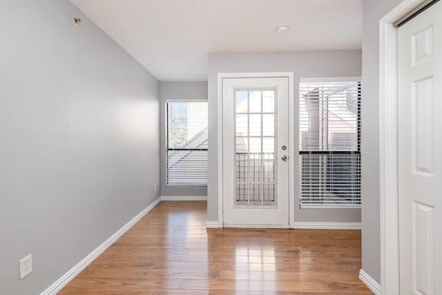 entryway with hardwood / wood-style floors