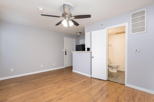 interior space featuring ceiling fan and light hardwood / wood-style flooring