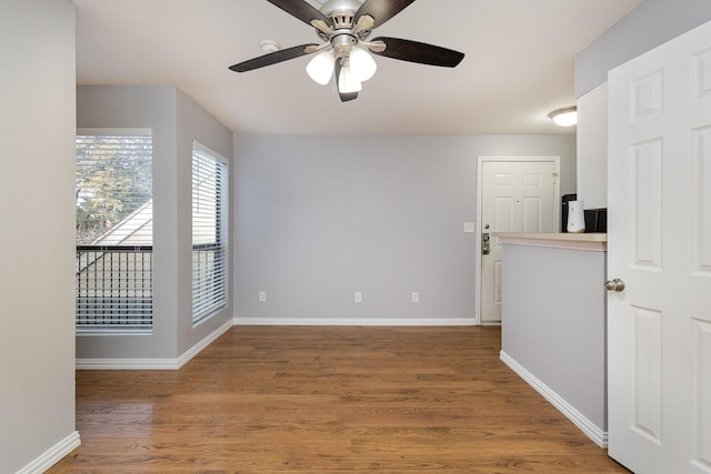 spare room featuring ceiling fan and hardwood / wood-style floors