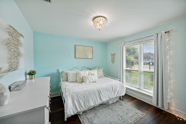 bedroom featuring dark hardwood / wood-style flooring