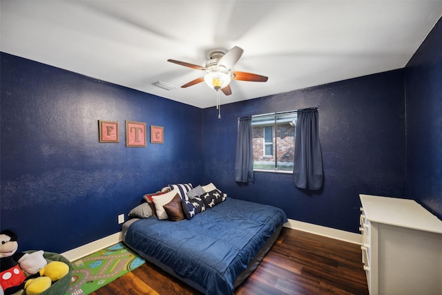 bedroom featuring dark wood-type flooring and ceiling fan