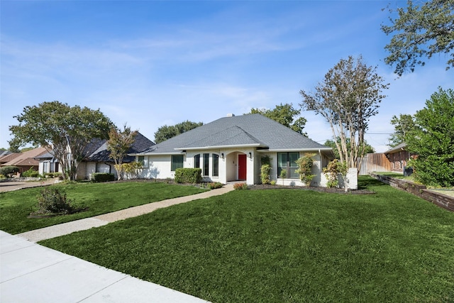 single story home featuring a front yard