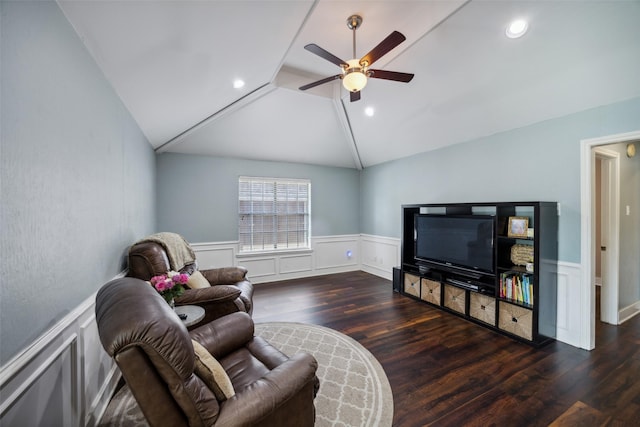 living room with ceiling fan, lofted ceiling, and dark hardwood / wood-style floors