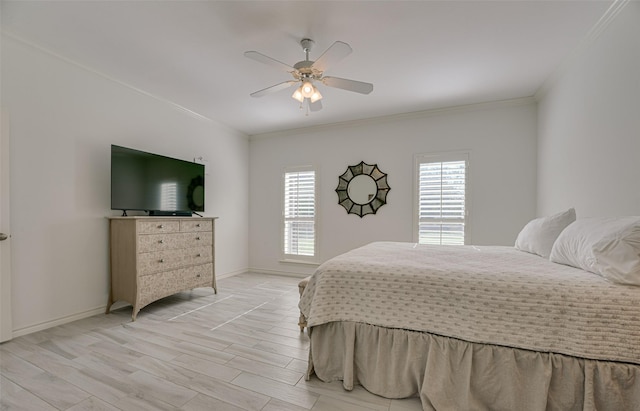 bedroom featuring ceiling fan, crown molding, and multiple windows