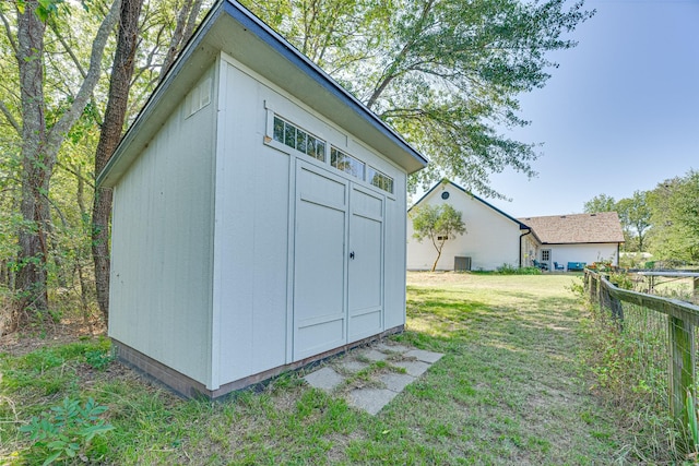 view of outbuilding with a yard