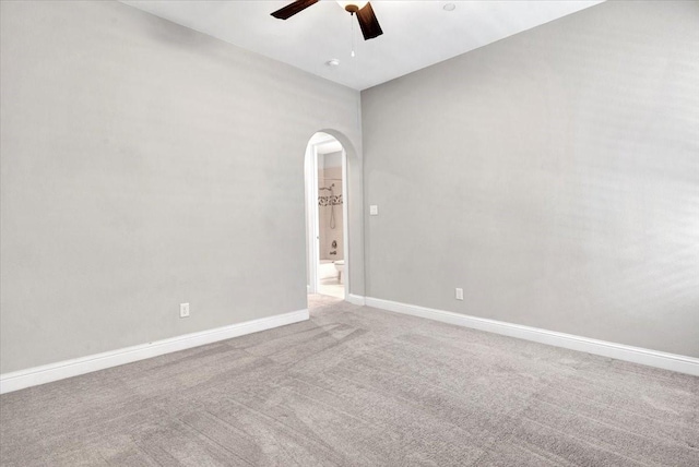 carpeted empty room featuring ceiling fan