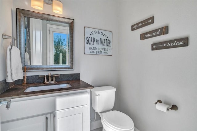 bathroom with vanity and toilet