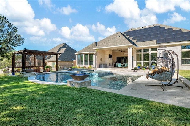 view of pool with a lawn, cooling unit, pool water feature, ceiling fan, and a patio