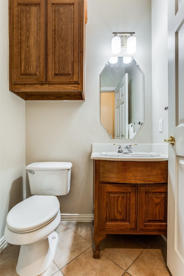 bathroom with vanity, tile patterned floors, and toilet