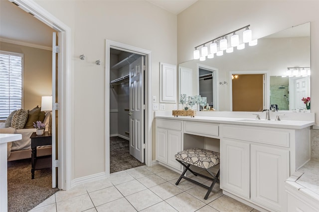 bathroom with tile patterned flooring, vanity, and ornamental molding