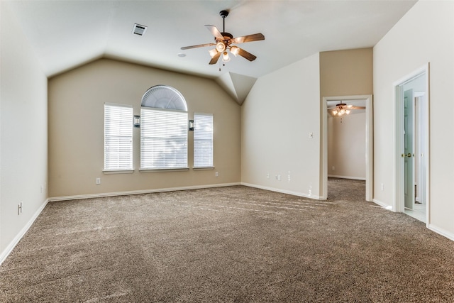 spare room with ceiling fan, carpet floors, and vaulted ceiling