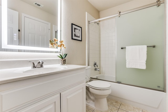 full bathroom with tile patterned flooring, vanity, toilet, and combined bath / shower with glass door