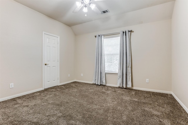 empty room with lofted ceiling, ceiling fan, and carpet