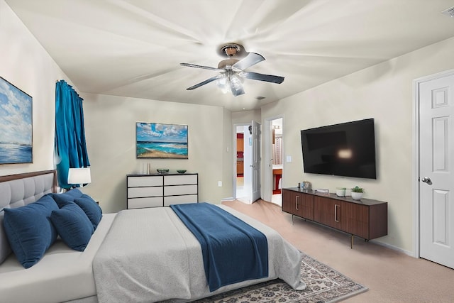 bedroom featuring ceiling fan, visible vents, baseboards, and light colored carpet