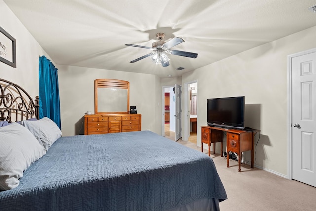 bedroom featuring light carpet, a ceiling fan, visible vents, and baseboards