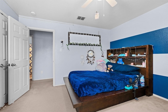 bedroom featuring a ceiling fan, carpet flooring, visible vents, and baseboards