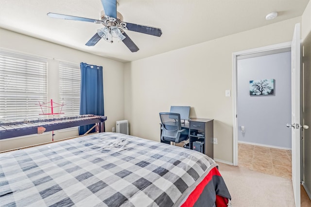 bedroom featuring baseboards, a ceiling fan, light colored carpet, and radiator