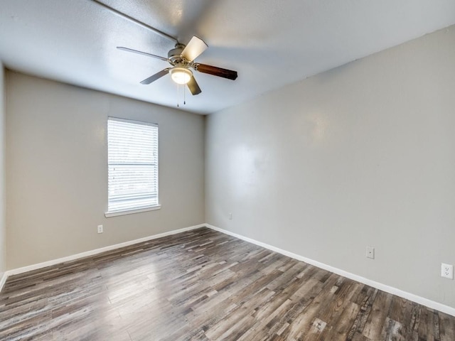 1122 Millview Dr Unit 1006, Arlington, TX 76012 - empty room with baseboards, a ceiling fan, and wood finished floors