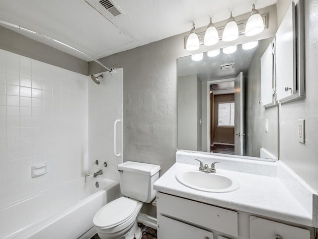 1122 Millview Dr Unit 1006, Arlington, TX 76012 - bathroom with vanity, visible vents, toilet, a textured wall, and shower / bathing tub combination