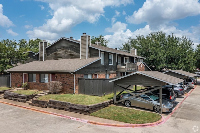 1122 Millview Dr Unit 1006, Arlington, TX 76012 - view of front of property with a front yard, a shingled roof, a chimney, fence, and brick siding