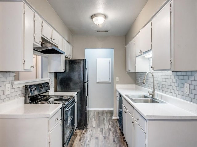 1122 Millview Dr Unit 1006, Arlington, TX 76012 - kitchen with wood finished floors, a sink, backsplash, and black / electric stove