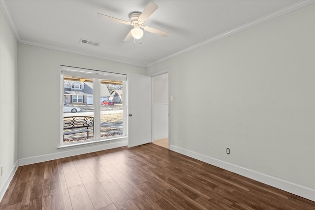 empty room with crown molding, dark hardwood / wood-style floors, and ceiling fan