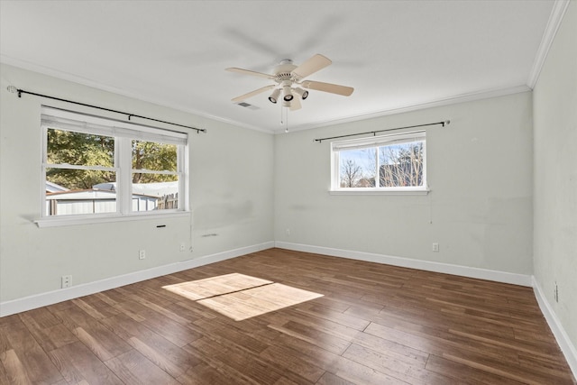 spare room with crown molding, ceiling fan, plenty of natural light, and dark hardwood / wood-style flooring