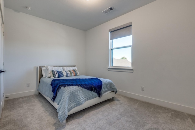 bedroom with light carpet