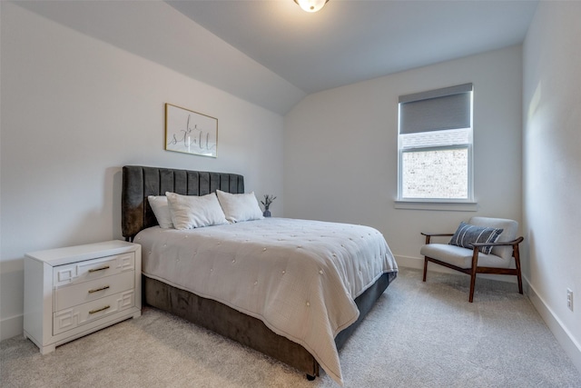 carpeted bedroom featuring vaulted ceiling