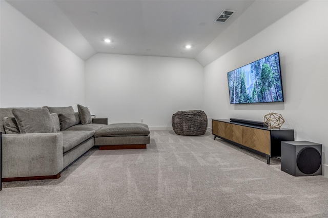 living room featuring lofted ceiling and carpet