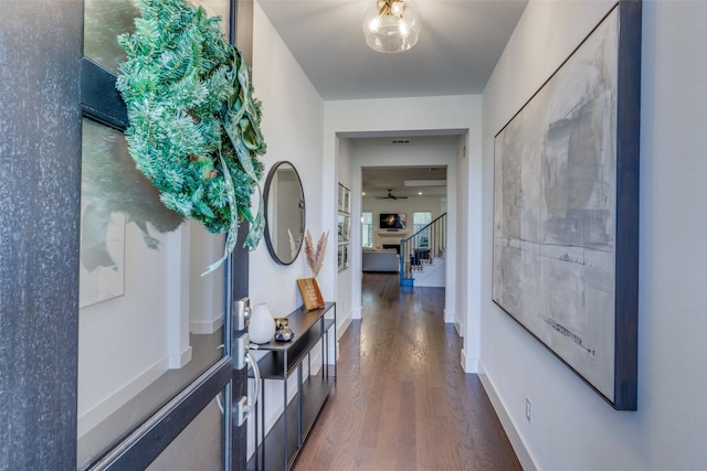 corridor with dark hardwood / wood-style floors