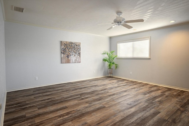 spare room with ceiling fan, dark wood-type flooring, a textured ceiling, and ornamental molding