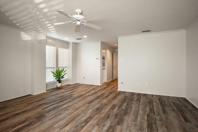 unfurnished room featuring ceiling fan, ornamental molding, and dark wood-type flooring