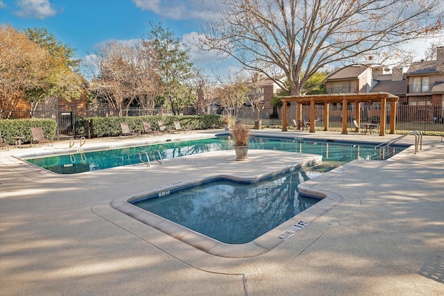 view of swimming pool with a patio area