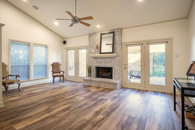 living room with a wealth of natural light, ceiling fan, french doors, and hardwood / wood-style flooring