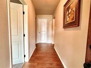 corridor featuring dark hardwood / wood-style flooring