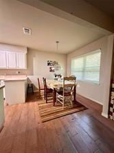 dining area featuring dark hardwood / wood-style flooring