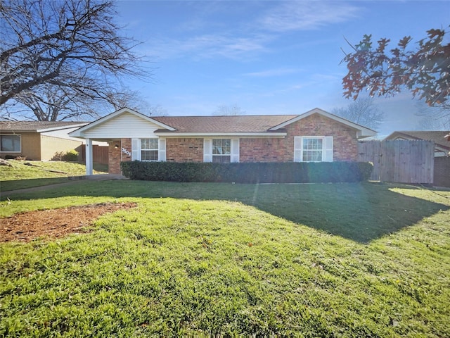 ranch-style house featuring a front lawn