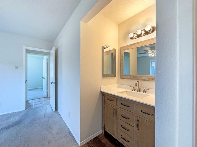 bathroom featuring ceiling fan and vanity