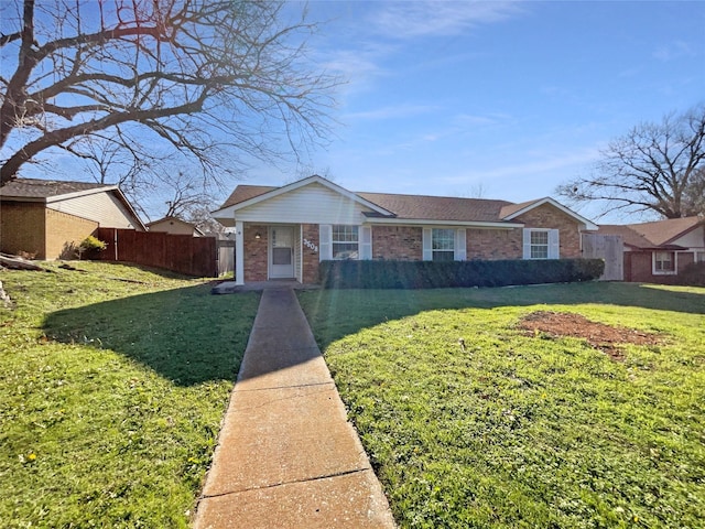 ranch-style house featuring a front lawn